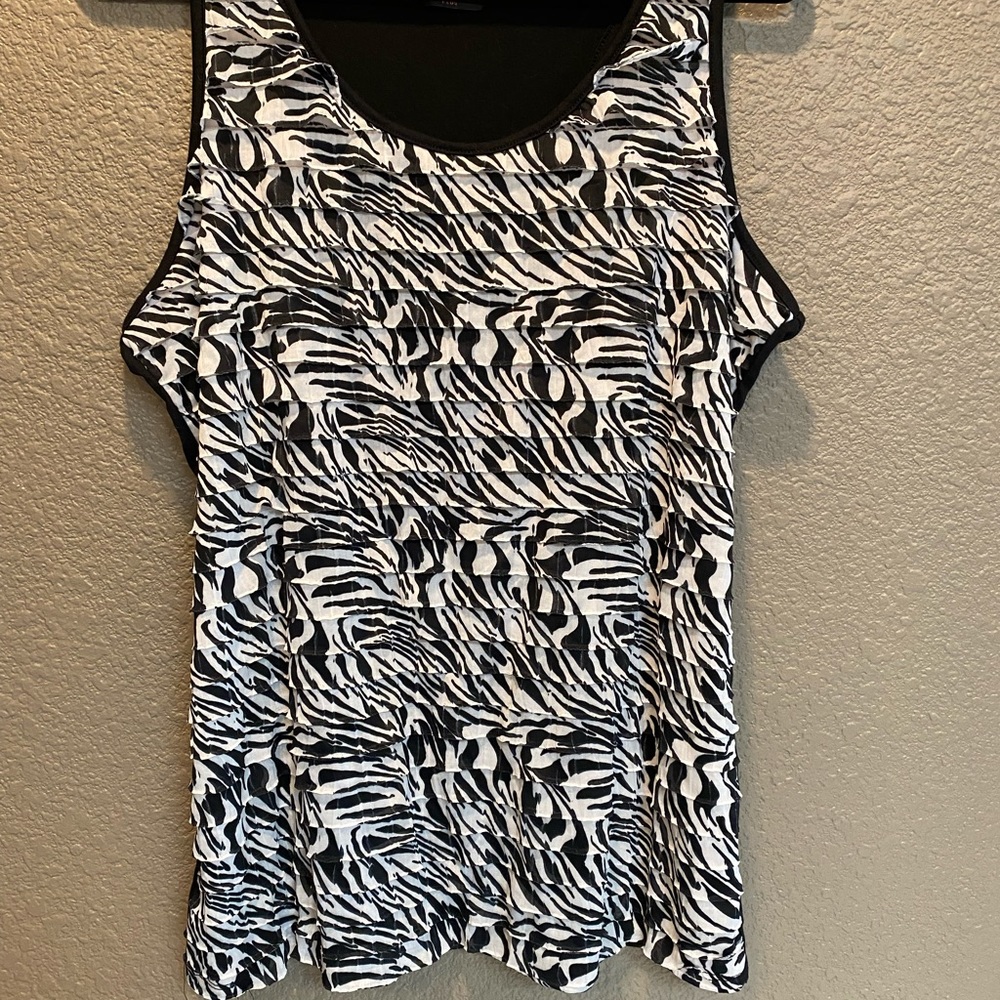 Black and white tank top with ruffle front and all black back. Like new.